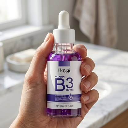 SknMaxxing niacinamide serum Vitamin B3 facial serum in clear dropper bottle held in hand